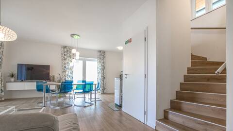Dining area connected to the living room in the Filip house – comfort for the whole family